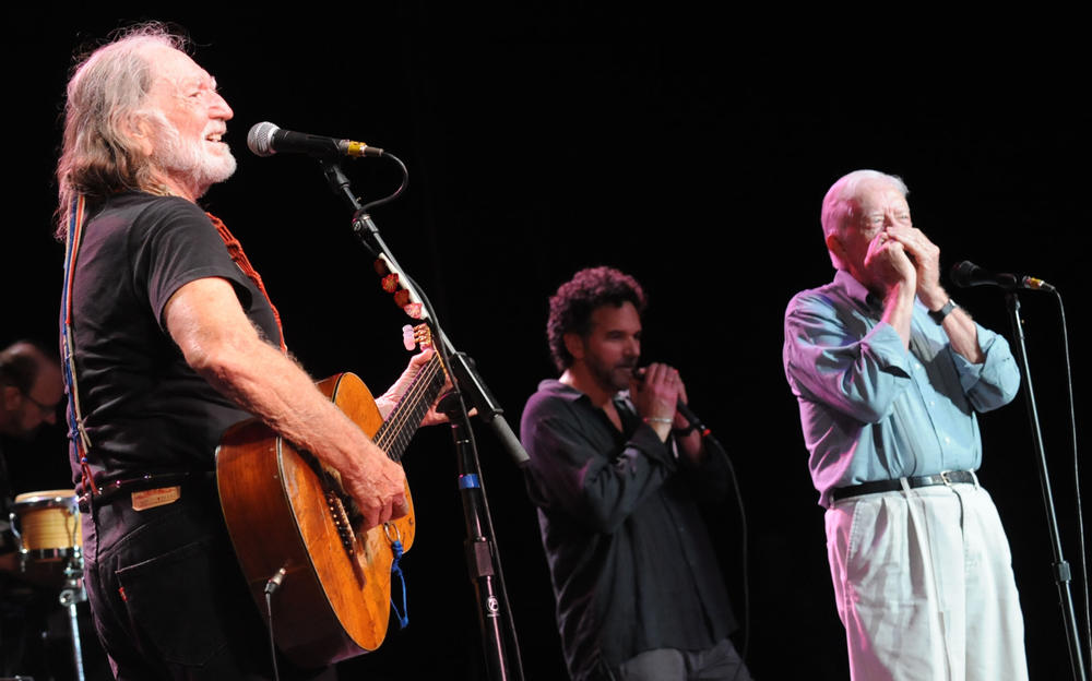 July 27, 2008: Willie Nelson is joined on stage by former President Jimmy Carter, who played harmonica on 