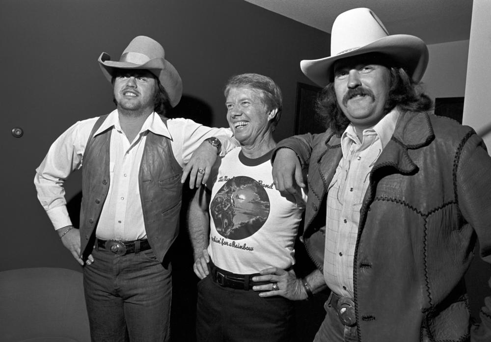 Oct. 31, 1975: (L-R) The Marshall Tucker Band guitarist Toy Caldwell, then-Georgia Gov. Jimmy Carter and The Marshall Tucker Band guitarist George McCorkle are photographed during a pre-concert reception for the governor at the Stouffer Hotel in Atlanta, Ga.