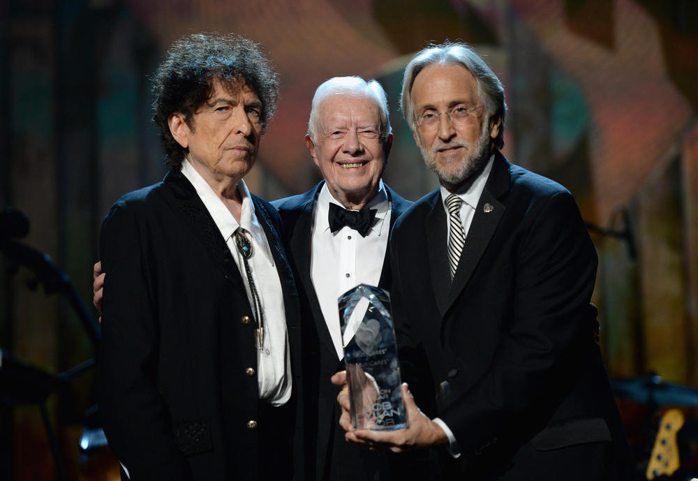 Feb. 6, 2015: (L-R) Honoree Bob Dylan, former President Jimmy Carter and Neil Portnow, president of the National Academy of Recording Arts and Sciences, pose together on stage at the 25th anniversary MusiCares 2015 Person Of The Year Gala honoring Dylan at the Los Angeles Convention Center.