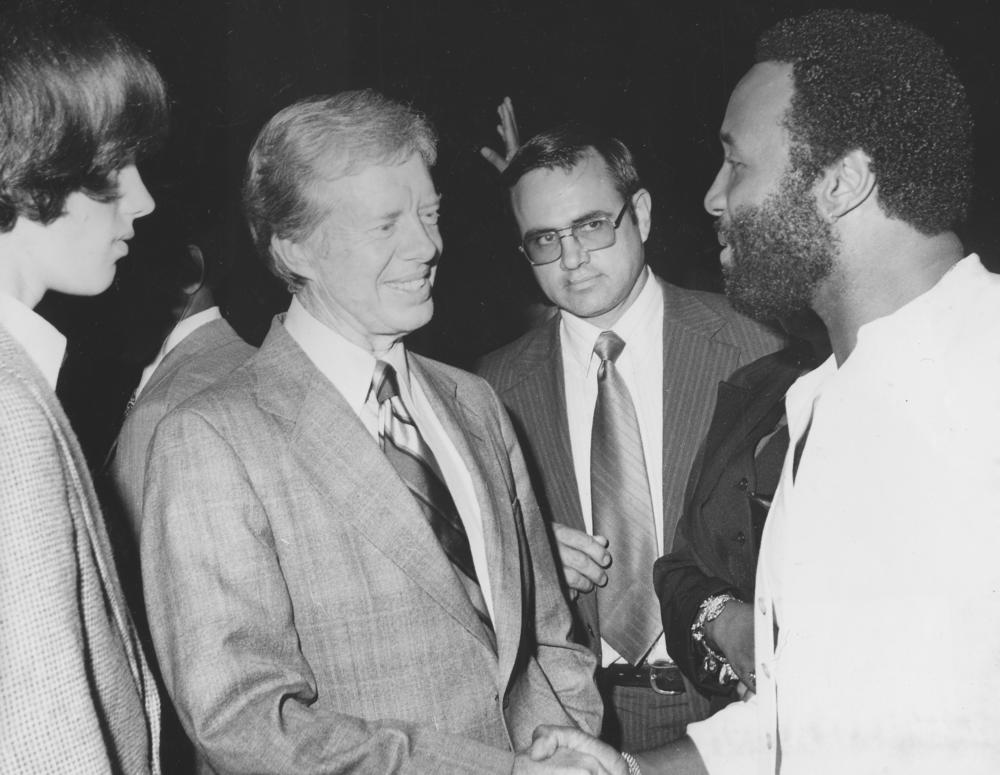 1977: Soul and gospel singer Andraé Crouch (R) meets former President Jimmy Carter at the White House Salute to Black Music in honor of the Black Music Association.