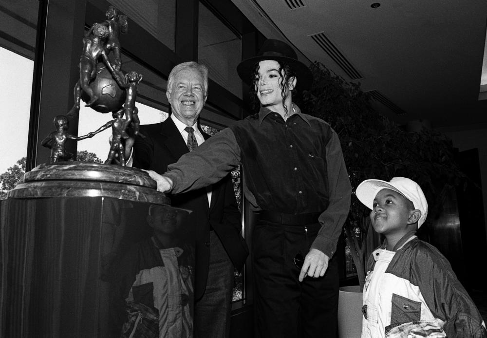 May 5, 1993: (L-R) Former President Jimmy Carter, singer-songwriter Michael Jackson and actor Emmanuel Lewis visit Atlanta, Ga., to boost Carter's Atlanta Project Immunization Drive.