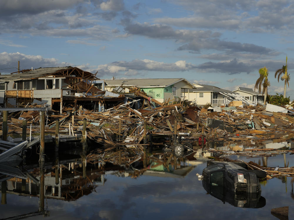 Debris along a canal in Fort Myers Beach, Fla., one week after Hurricane Ian. A new study warns that hurricanes are getting more dangerous because of climate change.