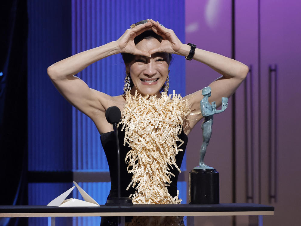 Michelle Yeoh accepts the SAG award for Outstanding Performance by a Female Actor in a Leading Role for <em>Everything Everywhere All at Once</em>.