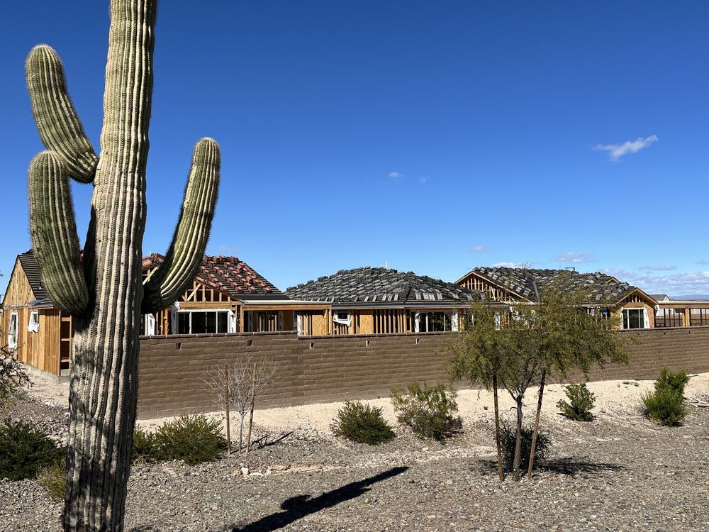 New homes under construction in the desert west of Phoenix.