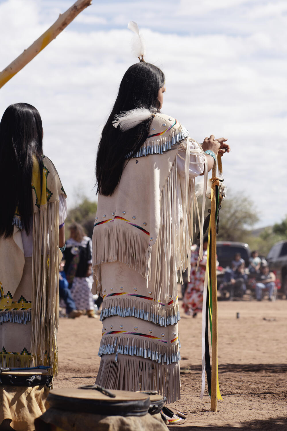 Lillian Begay and her partner wait to be painted.
