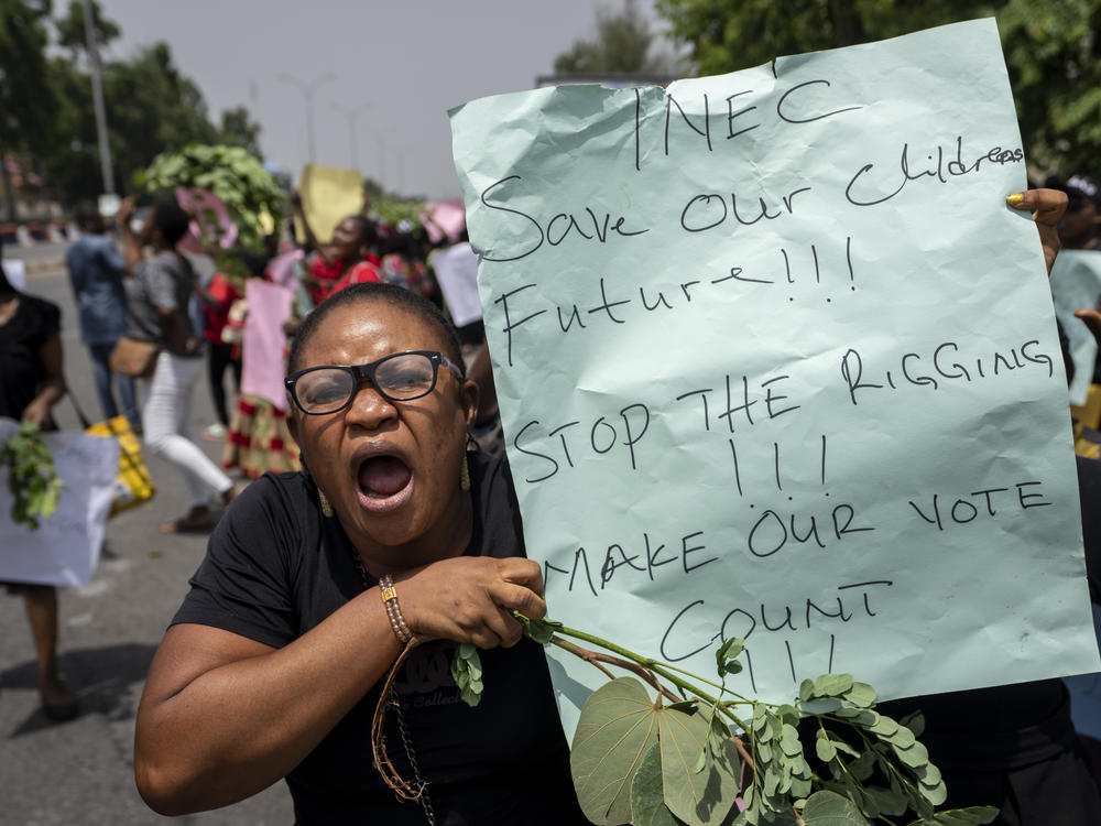 Demonstrators accusing the election commission of irregularities and disenfranchising voters make a protest in downtown Abuja, Nigeria.