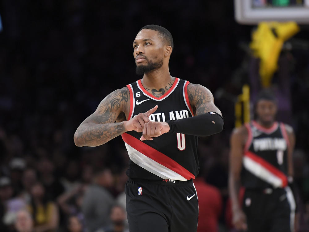 Damian Lillard of the Portland Trail Blazers taps his wrist signifying 