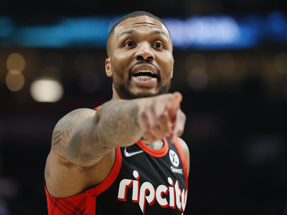 Damian Lillard of the Portland Trail Blazers reacts against the Phoenix Suns during the first quarter on December 14, 2021 in Portland, Ore.