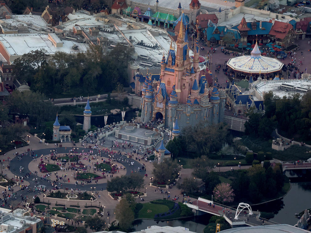 In an aerial view, Walt Disney World's iconic Cinderella Castle is seen on the grounds of the theme park this February. On Monday, Florida Gov. Ron DeSantis took control of Disney's special tax district.