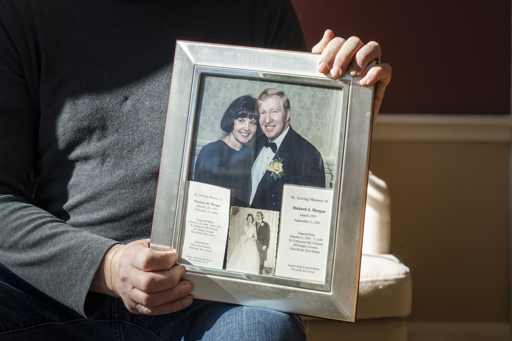 Glenn Morgan holds a portrait of his late parents, Patricia and Richard Morgan. Richard was a Con Edison employee who died in the World Trade Center collapse.