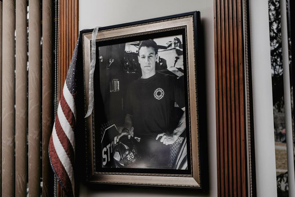 A photo of New York City firefighter Timothy Welty hangs on the wall of his childhood home in Queens, where his mother Adele Welty still lives.