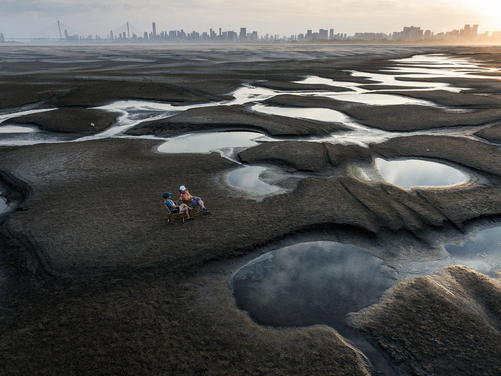 New coal plant approvals accelerated last summer as China saw historic heat waves that increased demand for air conditioning. The heat and an ongoing drought meant rivers dried up, including part of the Yangtze. China's grid struggled as hydropower went offline.