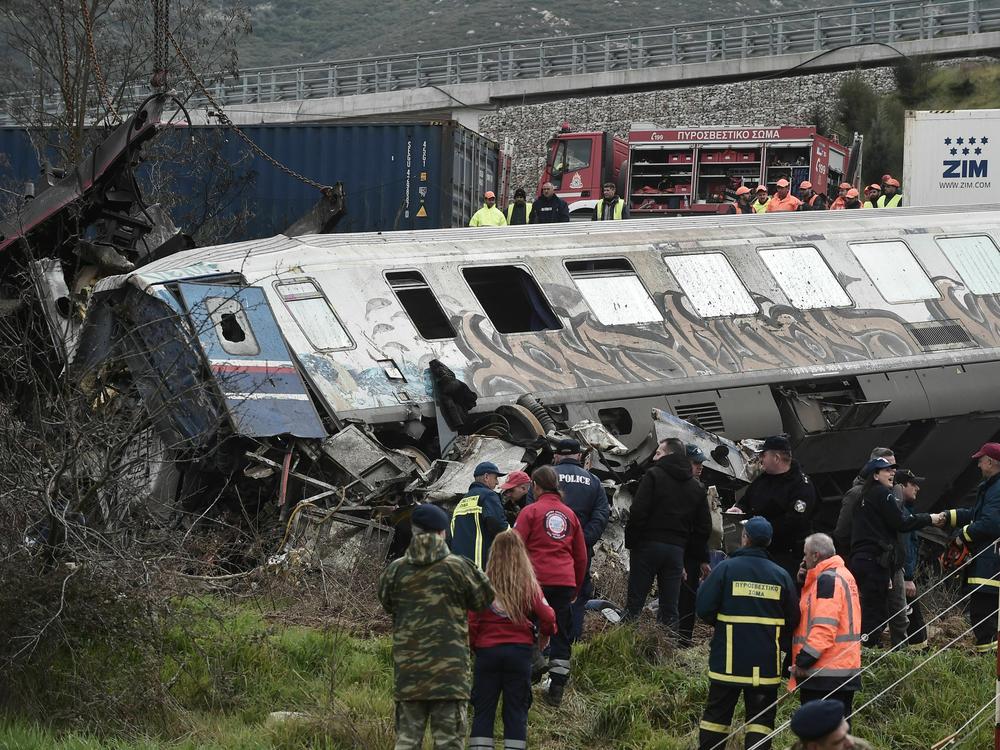 Greek police and emergency crews search wreckage Wednesday after the train derailment. Authorities say the first two passenger carriages nearly disintegrated after catching fire and reaching a temperature of nearly 2,300 degrees Fahrenheit.