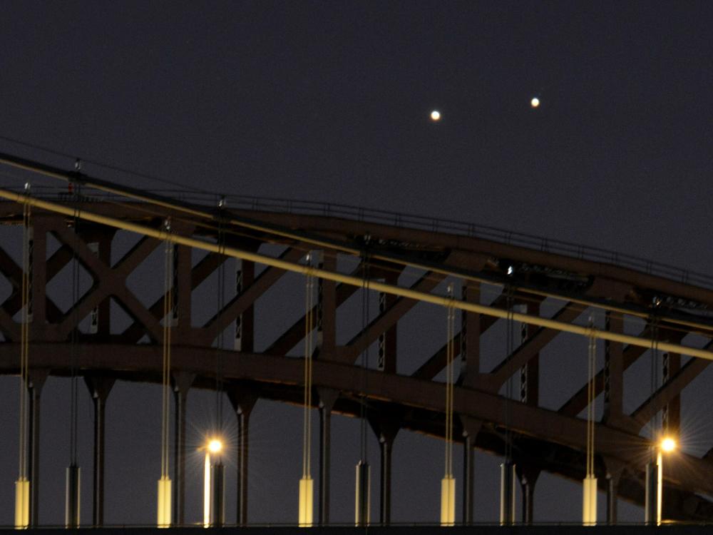 Venus and Jupiter, in a rare conjunction, seem close even though they are 400 million miles apart.