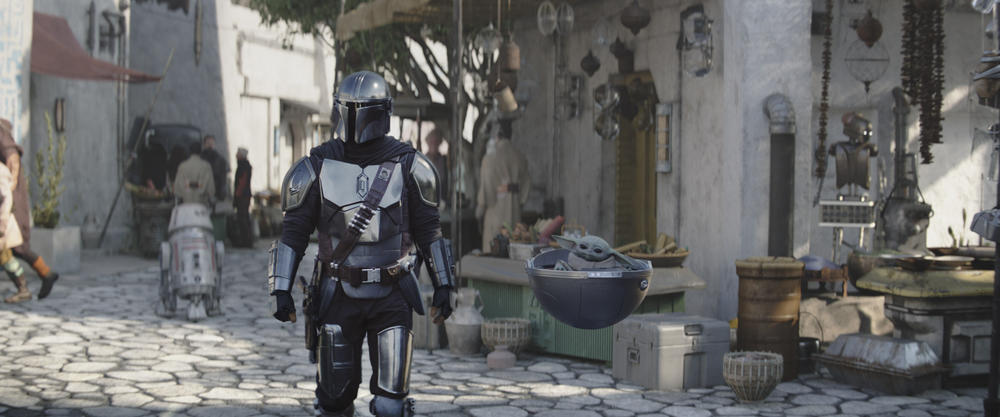 In the first few episodes of <em>The Mandalorian </em>Season 3, there is way too much tell and not enough show — but it's too early to abandon the series. Above, Grogu and Pedro Pascal as Din Djarin.