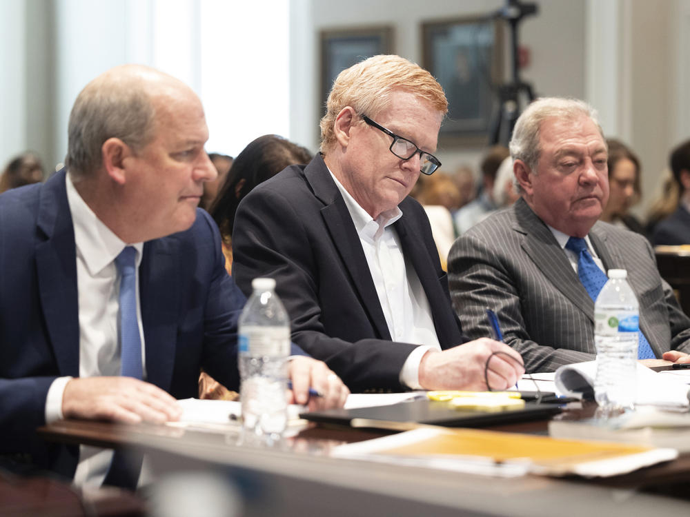 The legal team for Alex Murdaugh (center) presented their closing argument in his double murder trial on Thursday. He's seen here listening to prosecutor Creighton Waters make his closing arguments at the Colleton County Courthouse in Walterboro, S.C.