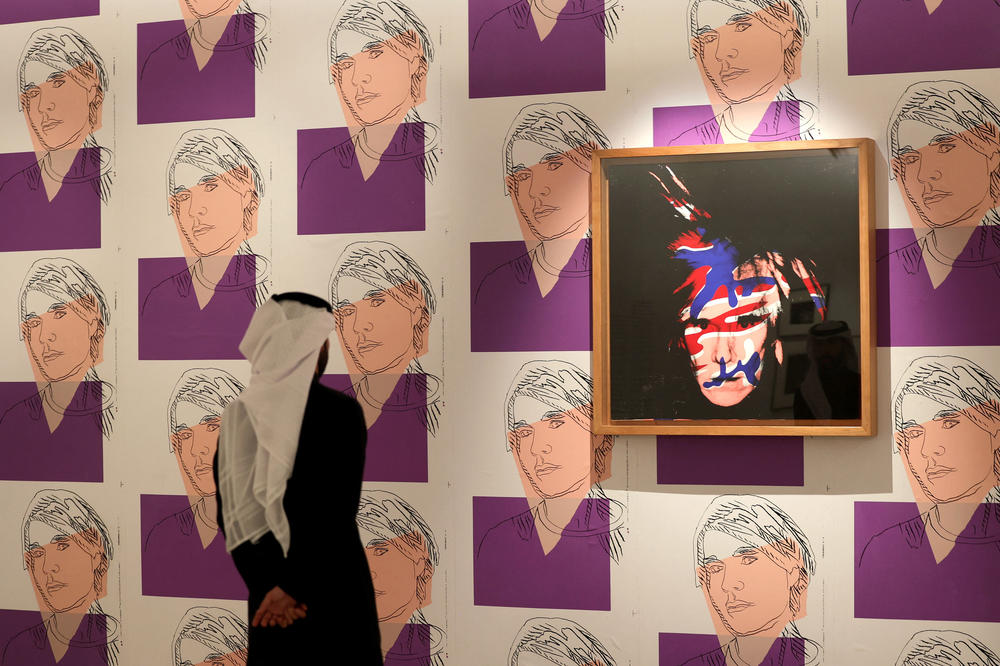 A Saudi man visits an arts exhibition by late US artist Andy Warhol at the Maraya concert hall in the ruins of AlUla, a UNESCO World Heritage site in northwestern Saudi Arabia, on February 19, 2023.