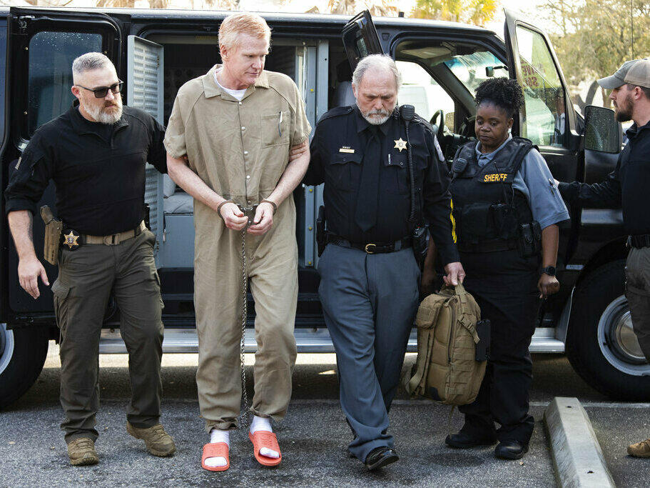Alex Murdaugh was hit with a punishment of two life sentences on Friday, over the double murder of his wife and son in 2021. He's seen here being led into the Colleton County Courthouse by sheriff's deputies for sentencing in Walterboro, S.C.