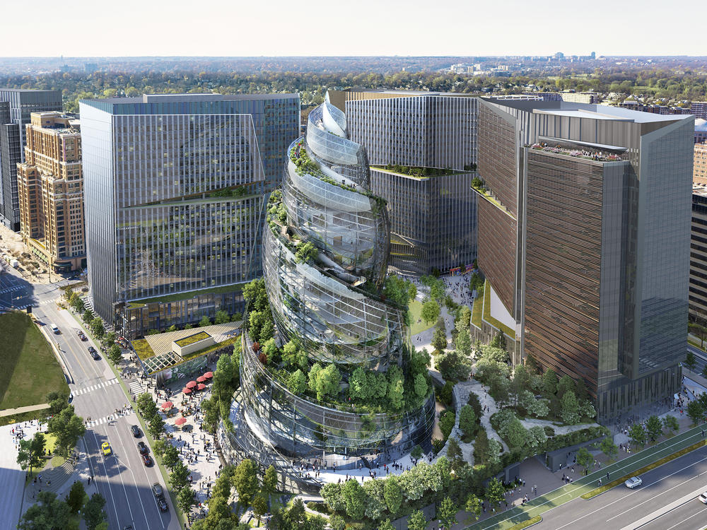This artist rendering provided by Amazon shows the next phase of the company's headquarters redevelopment to be built in Arlington, Va. Amazon is pausing construction of its second headquarters there following the biggest round of layoffs in the company's history and the shifting landscape of remote work.