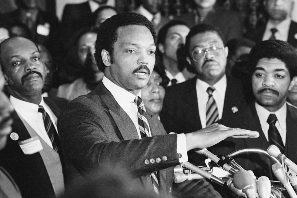 Hitting President Reagan's policy of shelling Lebanon, Democratic presidential candidate Rev. Jesse Jackson was critical of Reagan ordering naval and air strikes on Beirut. Jackson spoke at a meeting where Chicago black alderman announced their support of his candidacy.