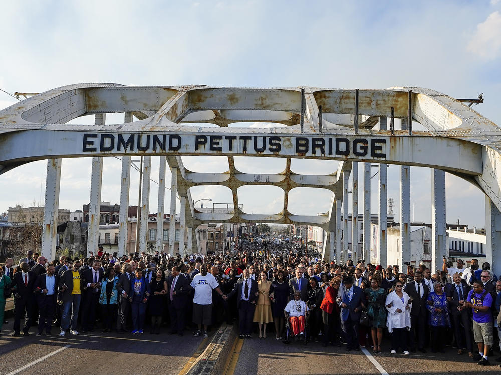 Vice President Kamala Harris marches on the Edmund Pettus Bridge after speaking in Selma, Ala., on the anniversary of 