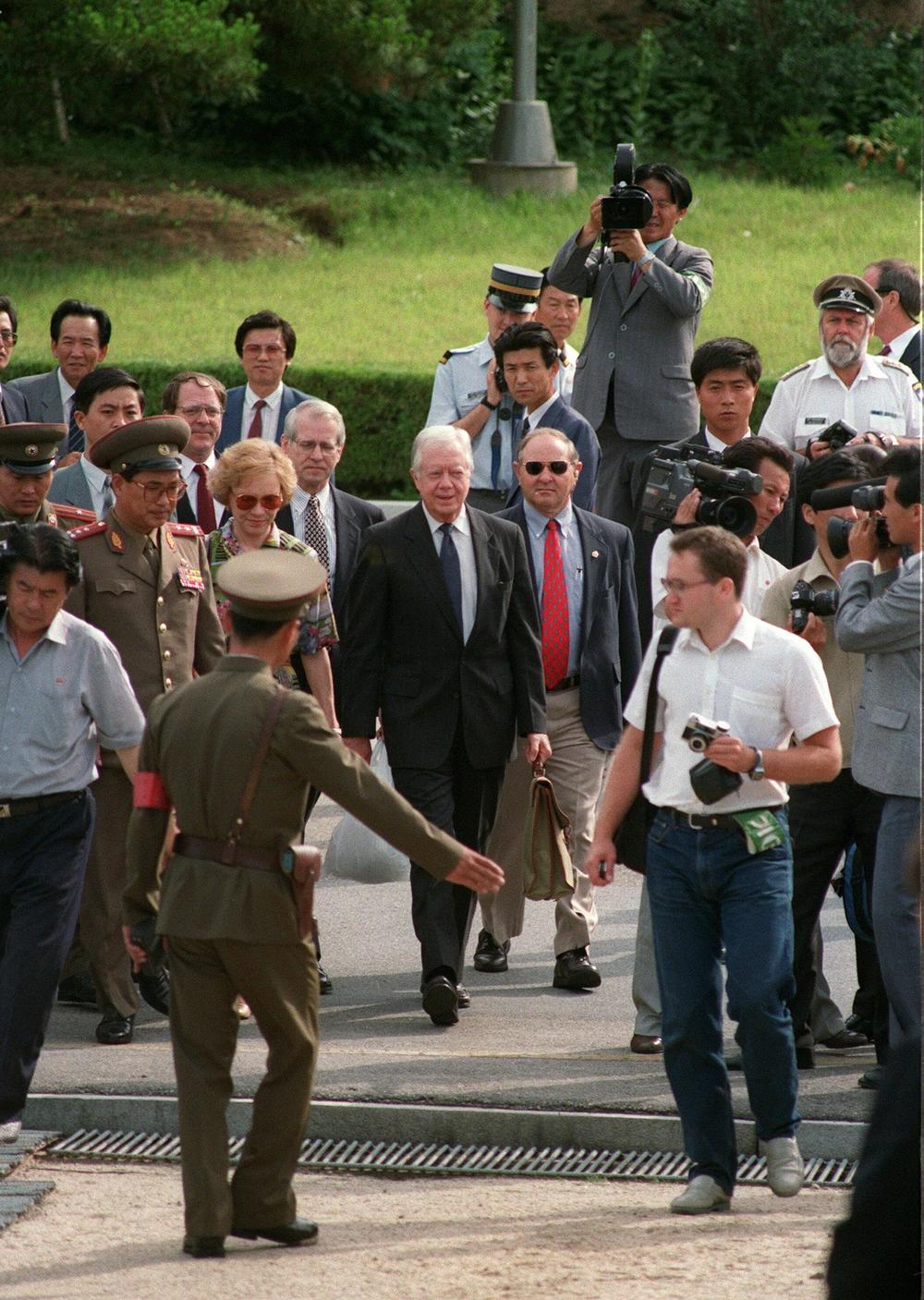 June 18, 1994: North Korean border guard showing a weary-looking former US President Jimmy Carter (C) and his wife Rosalynn (L), the way to the South Korea side of the demilitarized zone (DMZ) as they leave  North Korea through Panmunjom border village after Carter's controversial meeting with North Korean President Kim Il-sung.