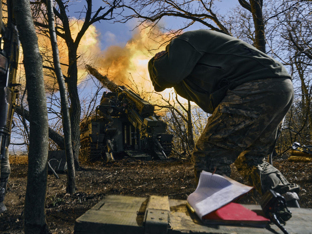 Ukrainian soldiers fire a self-propelled howitzer towards Russian positions near Bakhmut, Donetsk region, Ukraine, Sunday.