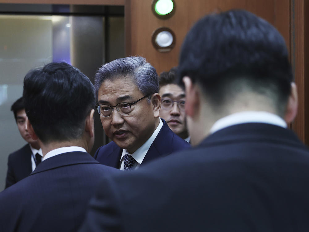 South Korean Foreign Minister Park Jin, center, leaves after a briefing announcing a plan on Monday to resolve a dispute over compensating people forced to work under Japan's 1910-1945 occupation of Korea, at the Foreign Ministry in Seoul, South Korea Monday, March 6, 2023.