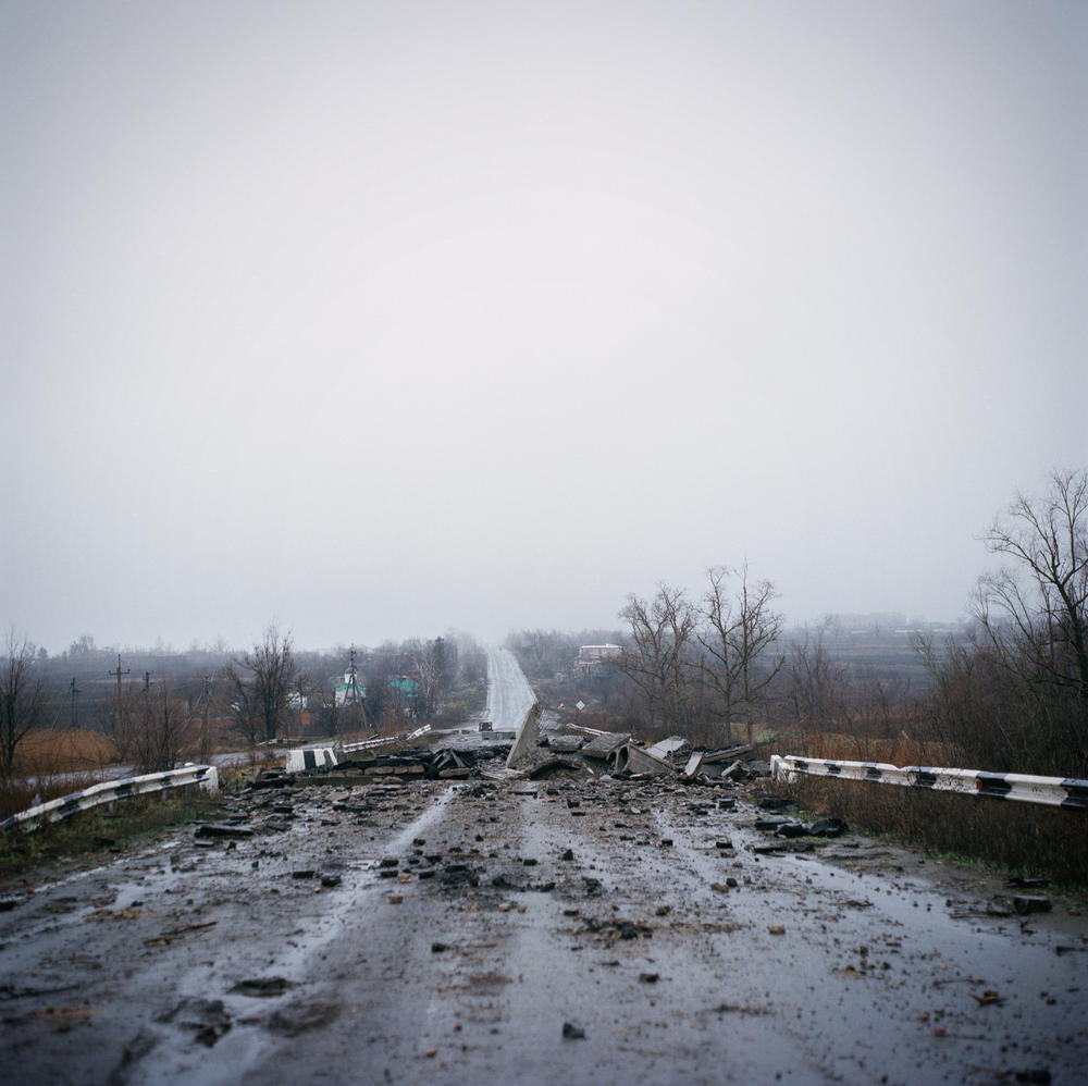 The road through Dolyna, near Slovyansk, a village that was razed to the ground after many months on the front line between Russian and Ukrainian forces. December 2022.