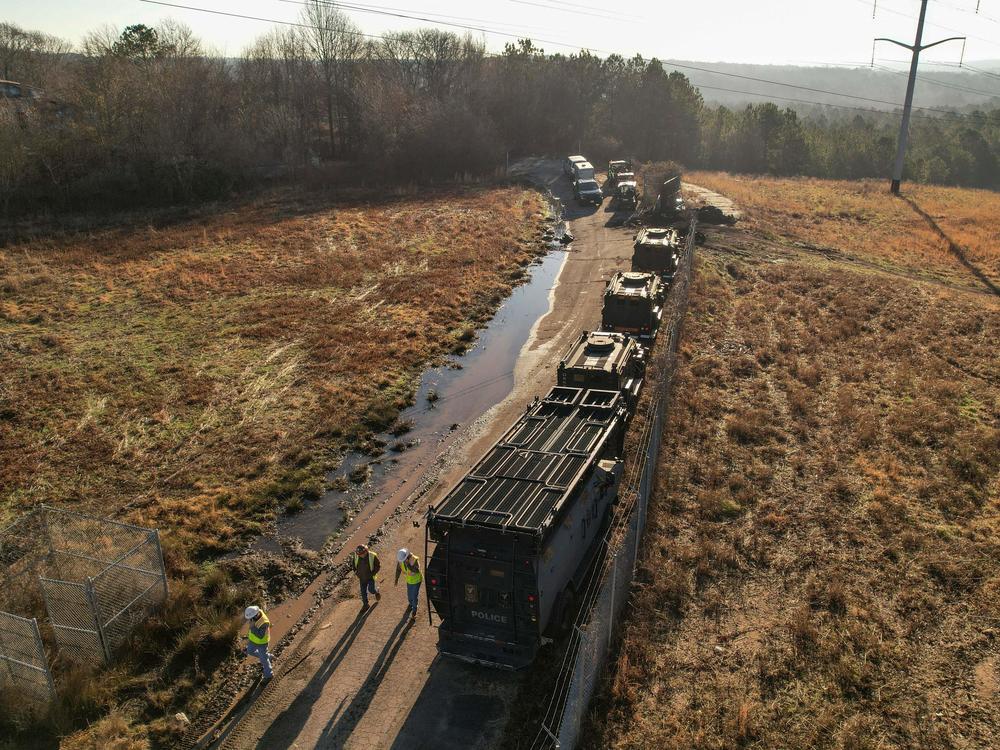 In this aerial view, law enforcement and construction crews are seen at the planned site of a police training facility near Atlanta on Feb. 6.