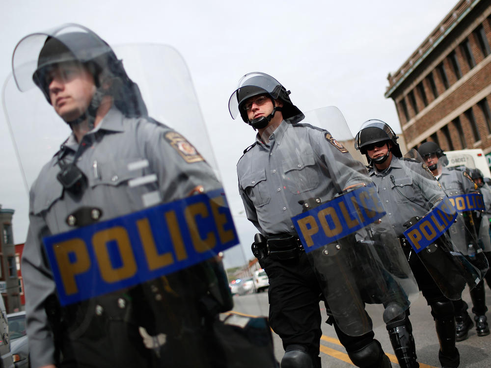 Pennsylvania state troopers deploy in Baltimore, Md, on May 1, 2015, following the release of a report on the death of Freddie Gray. Gray, 25, died April 19, 2015 from a severe spinal cord injury he received while in police custody.