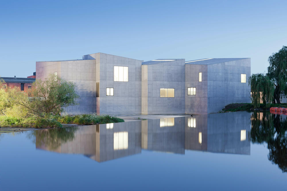 The Hepworth Wakefield art museum in West Yorkshire, U.K., is situated on the River Calder and is accessible only by footbridge.