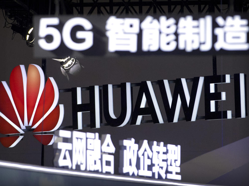 Signs promoting 5G wireless technology from Chinese technology firm Huawei are displayed at the PT Expo in Beijing in 2018. Germany is reviewing the presence of Huawei and ZTE components in its telecommunications.