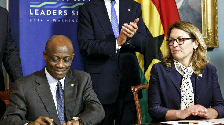 Dana Hyde, right, then CEO of the Millennium Challenge Corporation, participates in 2014 in the Ghana Compact signing ceremony at the State Department in Washington.