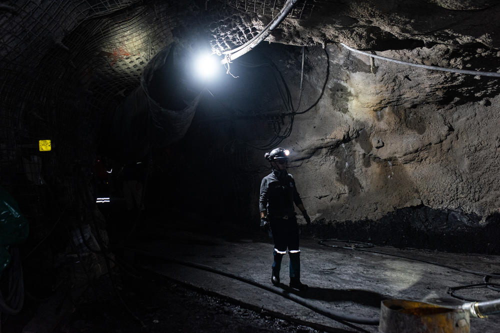 An emerald miner walks into the main tunnel at the mine in Muzo, Colombia, which is large enough to accommodate heavy machinery as the industry becomes more mechanized.