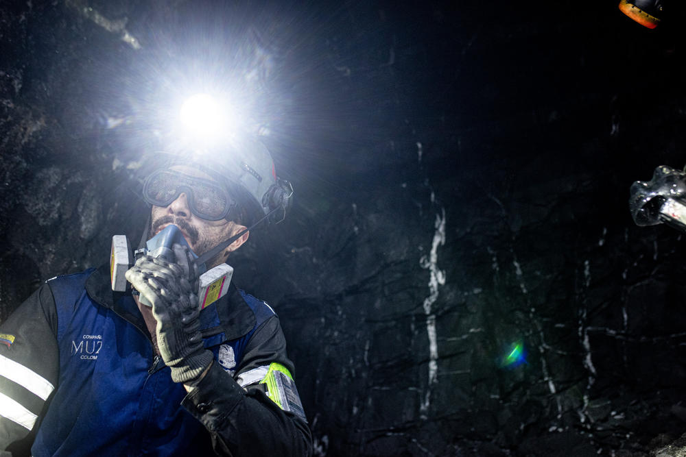 Geologist Camilo Pinzón takes a break after finding a vein in the calcite rocks with green specks, the telltale sign of emeralds.