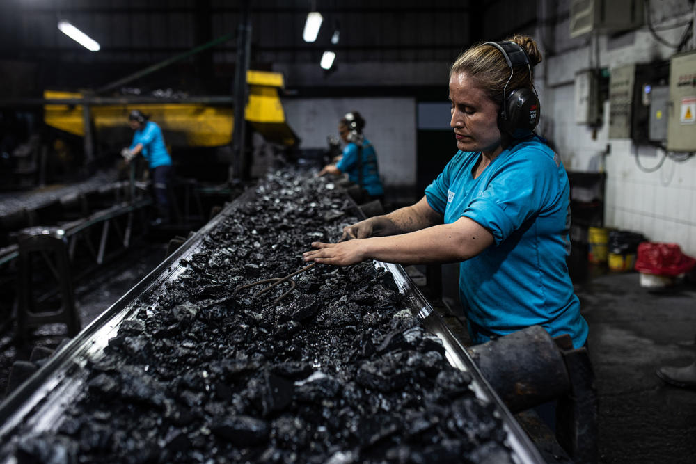 Women used to be scarce at Colombian emerald mines, but now they fill all sorts of positions, from geologists to workers checking rocks and debris on this conveyer belt for traces of emeralds.