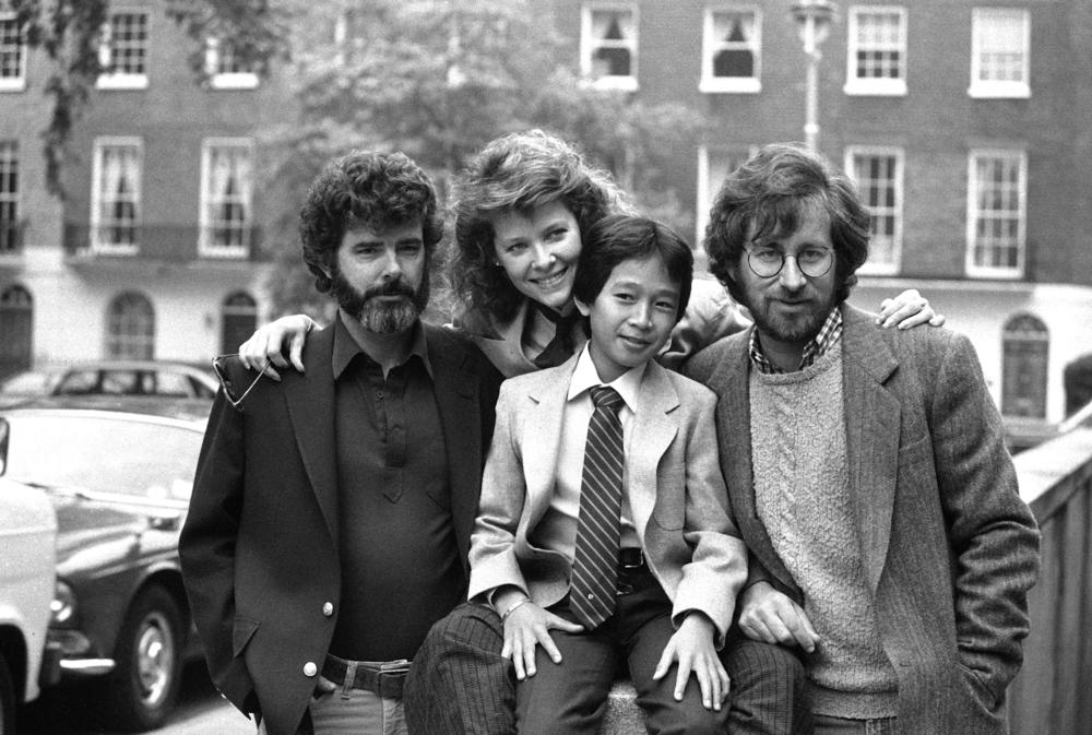 George Lucas, left, Kate Capshaw, Ke Huy Quan and Steven Spielberg in London in June 1984, for a premiere of their film <em>Indiana Jones and the Temple of Doom. </em>Quan quit acting after he found it difficult to land good roles in his 20s. He returned to the screen in <em>Everything Everywhere All at Once.</em>