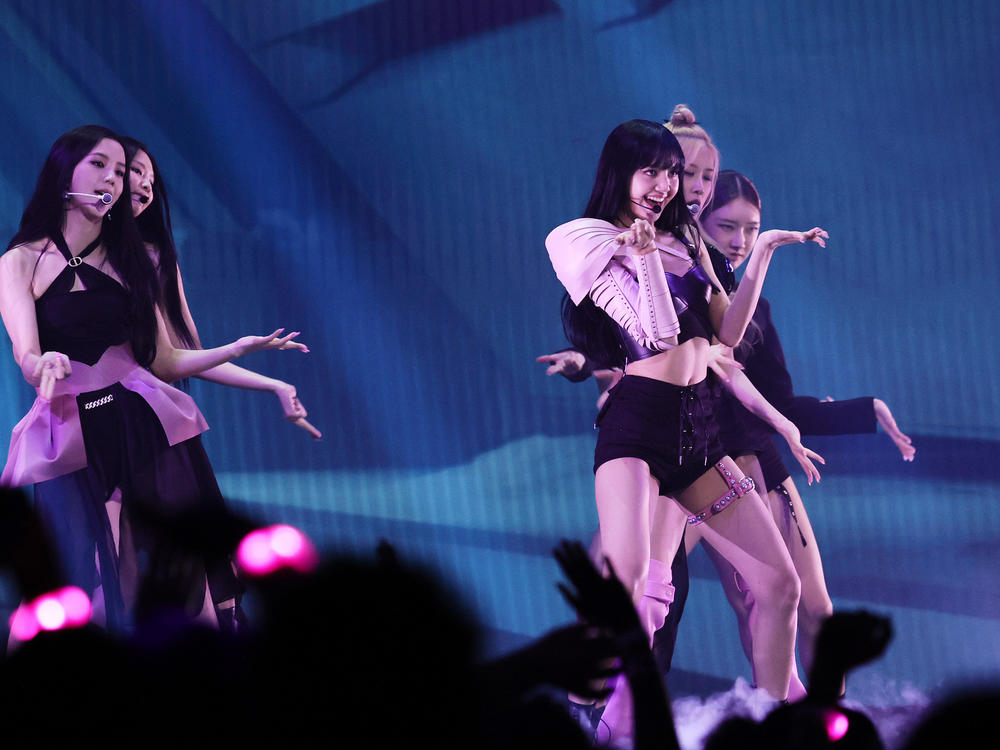 BLACKPINK, seen performing at the 2022 MTV VMAs, are now the most streamed female band on Spotify.