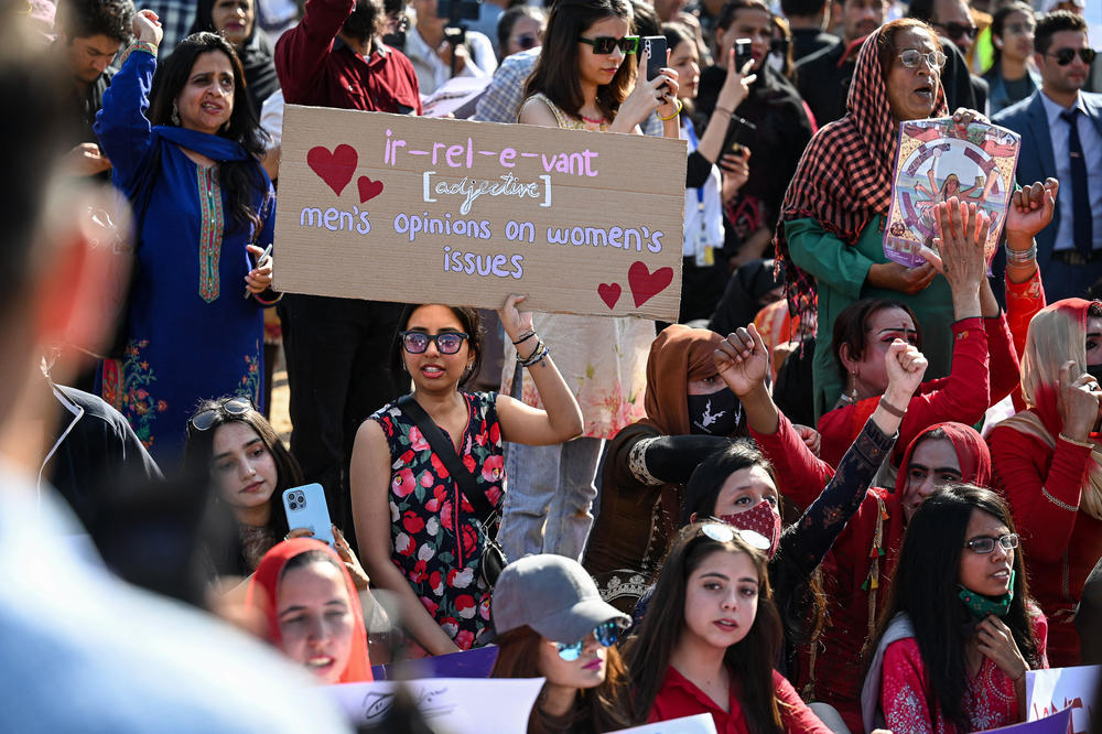 Activists hold placards and chant slogans during a rally to mark International Women's Day in Islamabad.