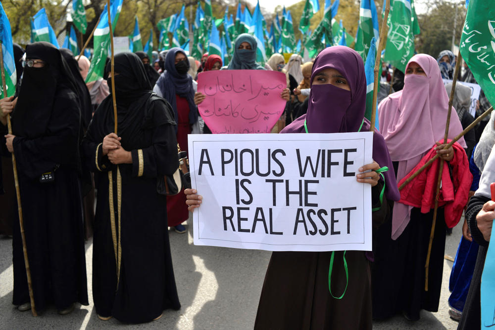 As women gathered to call for equal rights in Islamabad, conservative women demonstrated against the protesters.