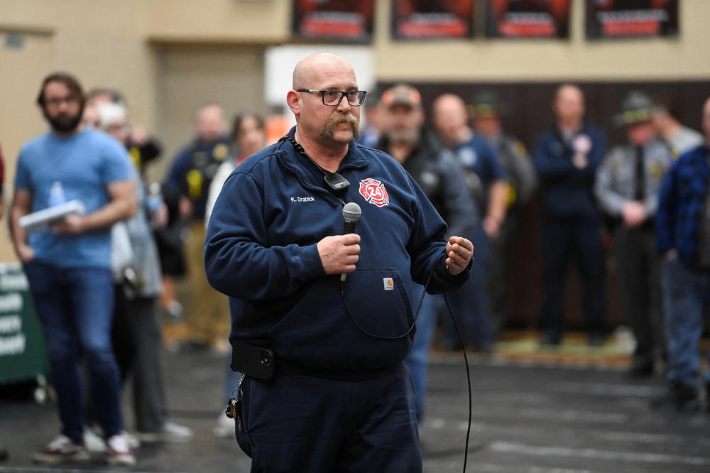 East Palestine Fire Chief Keith Drabick speaks with community members about safety concerns at a town hall meeting on Feb. 15.