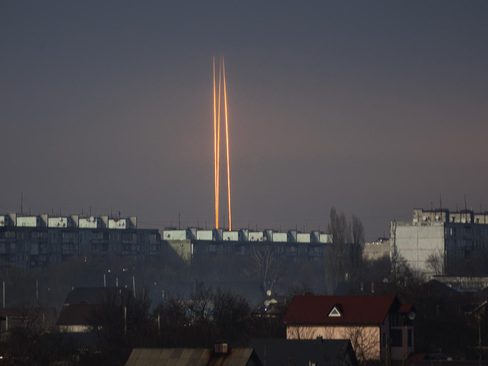 Three Russian rockets launched against Ukraine from Russia's Belgorod region are seen at dawn in Kharkiv, Ukraine, late Thursday, March 9, 2023.