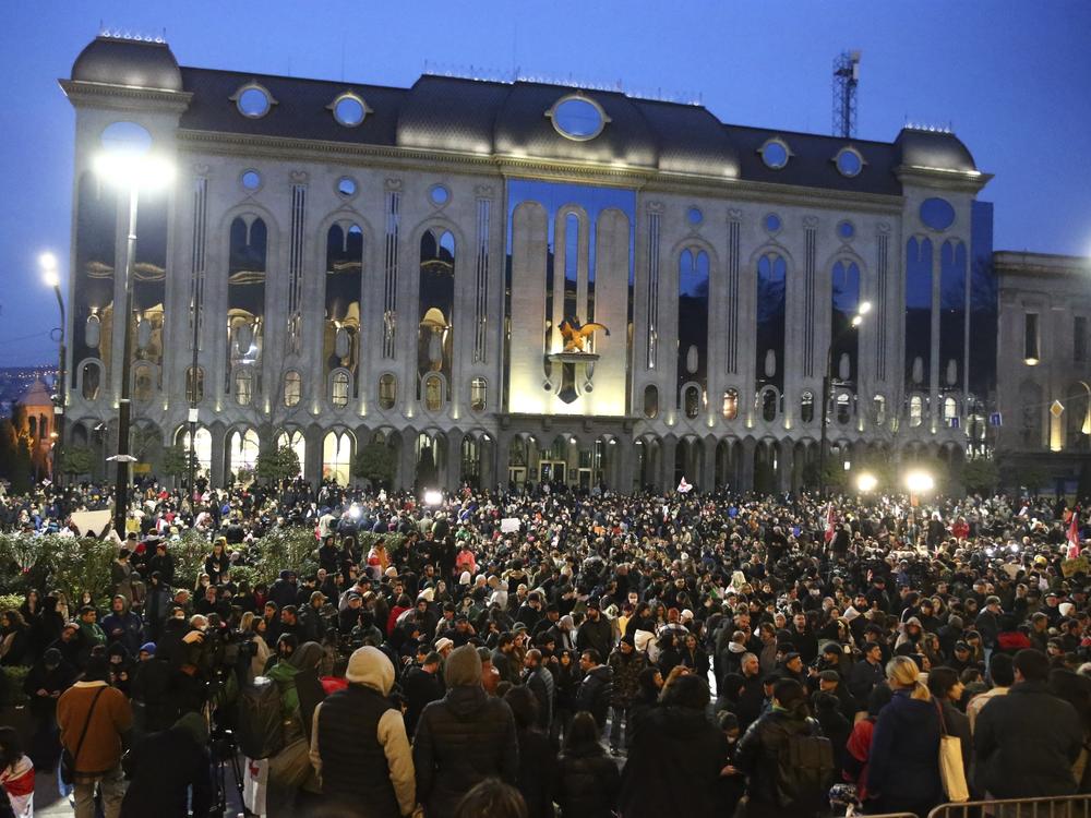 Protesters gather near the Georgian parliament building in Tbilisi on Thursday to protest the foreign agent bill.