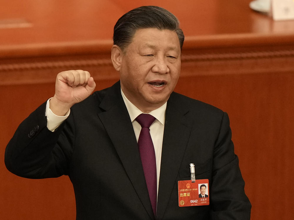 Chinese President Xi Jinping takes his oath after he is unanimously elected as President during a session of China's National People's Congress (NPC) at the Great Hall of the People in Beijing, Friday, March 10, 2023.