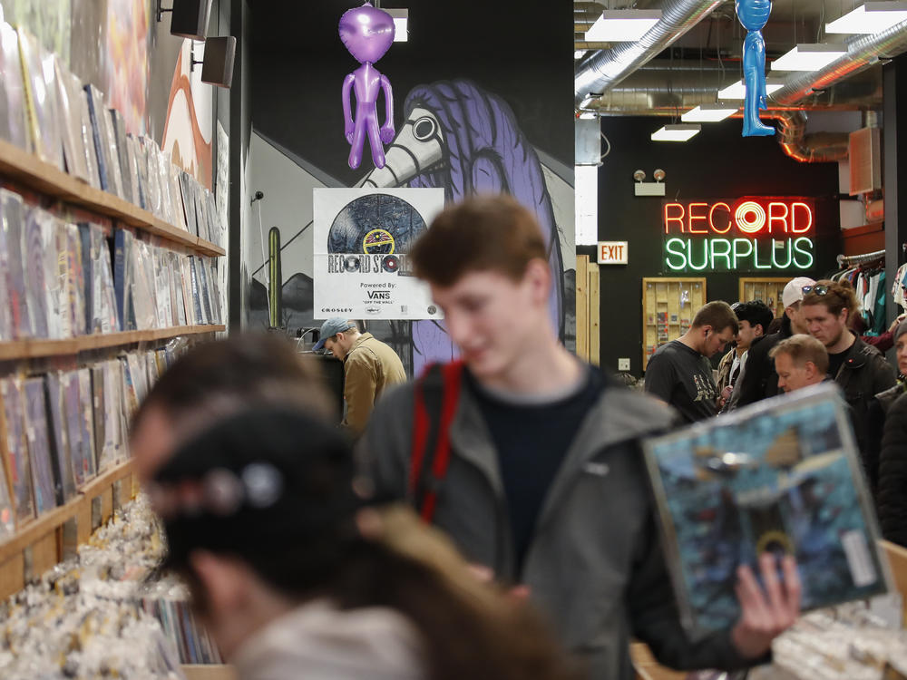 Customers shop at the Shuga Records store during the Record Store Day in Chicago on April 13, 2019. Vinyl record sales have been on the rise for 16 straight years, with an extra bump in demand during the pandemic.