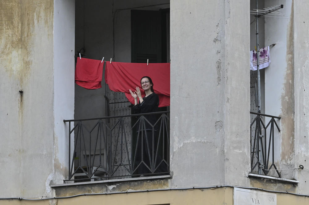 From windows and balconies in Rome, Italians cheered and made music to thank health workers. This photo was taken on March 14, 2020.