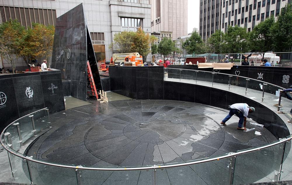A worker helps complete construction of the African Burial Ground Memorial on Oct. 1, 2007, in New York City.