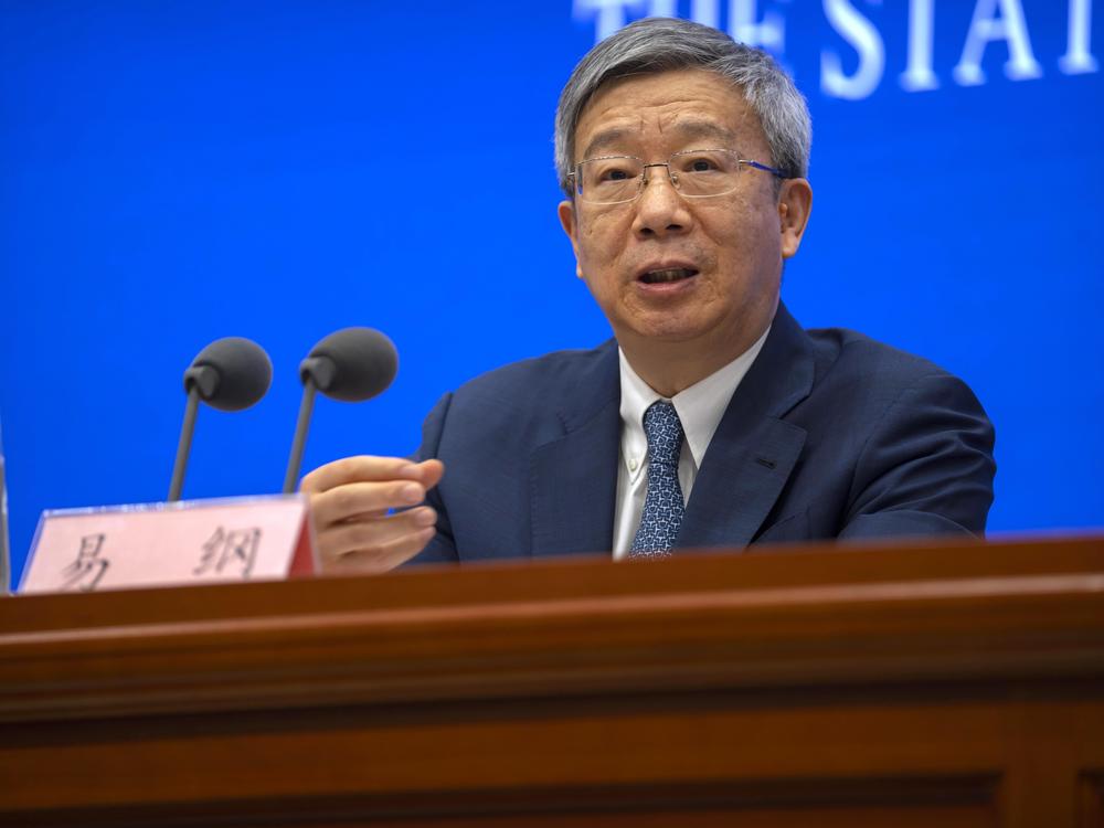 FILE - Yi Gang, governor of the People's Bank of China, speaks during a press conference at the State Council Information Office in Beijing, on March 3, 2023. China on Sunday, March 12, reappointed Yi as head of the central bank in an effort to reassure entrepreneurs and financial markets by showing continuity at the top while other economic officials change.