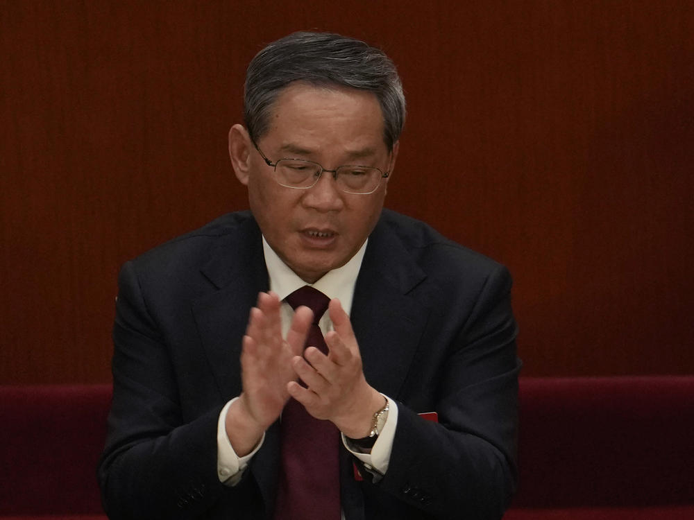 Politburo Standing Committee member Li Qiang attends a session of China's National People's Congress at the Great Hall of the People in Beijing, Tuesday, March 7, 2023.